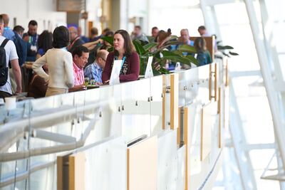 three people conversing