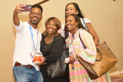 man standing using laptop